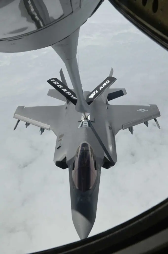 Looking down at a pain being refueled mid air