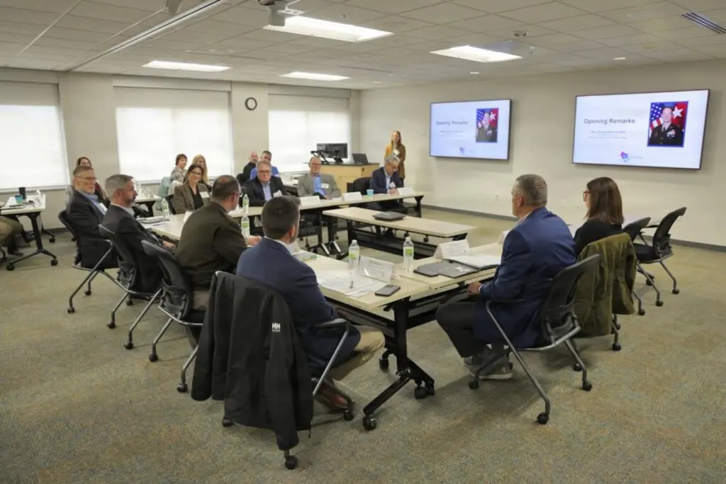 A group of people working around a conference table