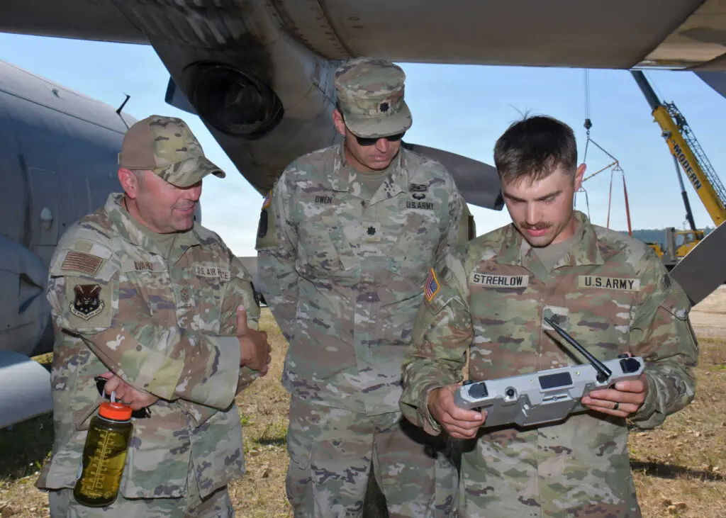 Three soldiers using a drone for recon on the recovery