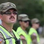 A group of guard members helping the community