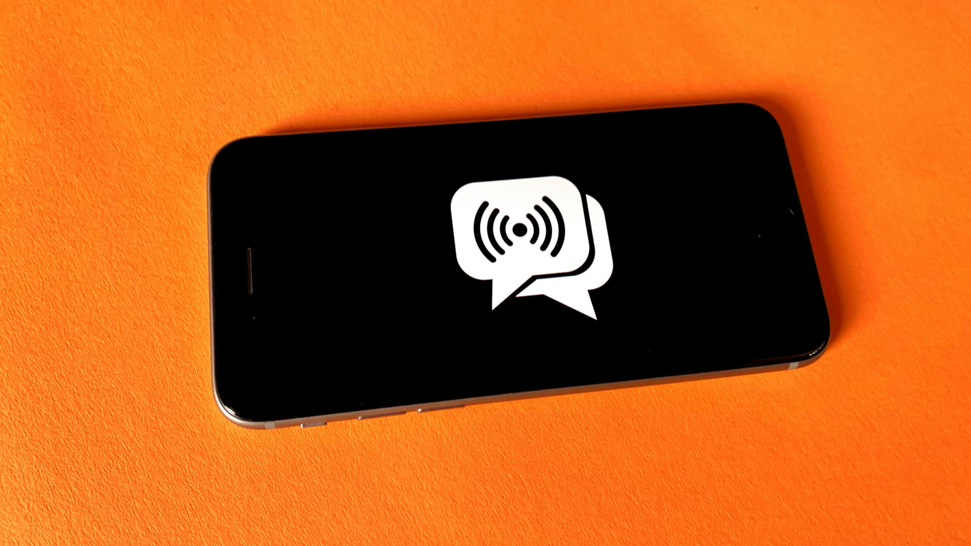 A phone with a generic social media icon on it