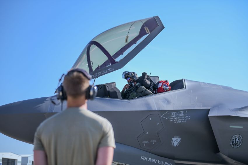 Pilot seated in a jet cockpit