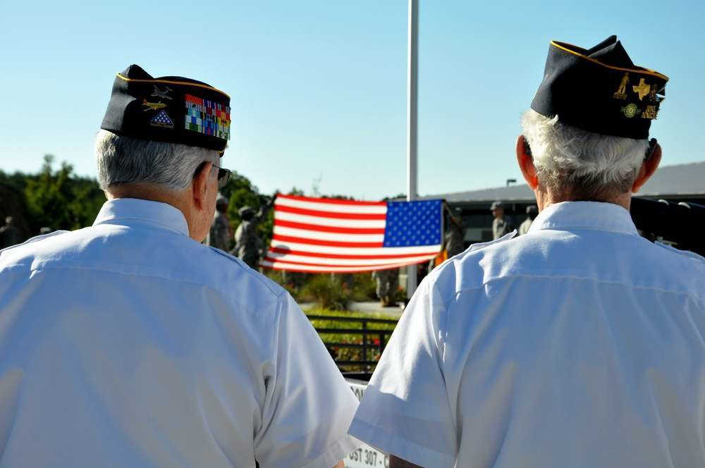 Veterans watching a flag lowering