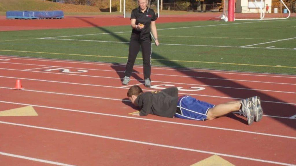 Example of someone laying down on a track as a start position