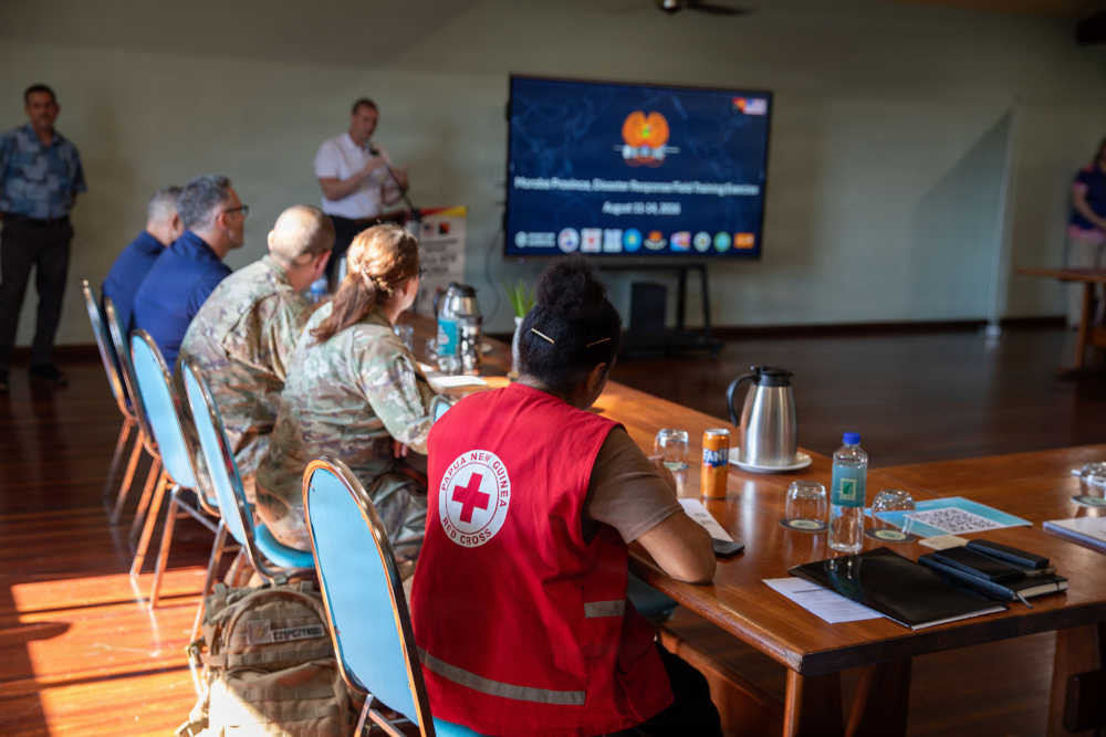 a group of people watching a presentation