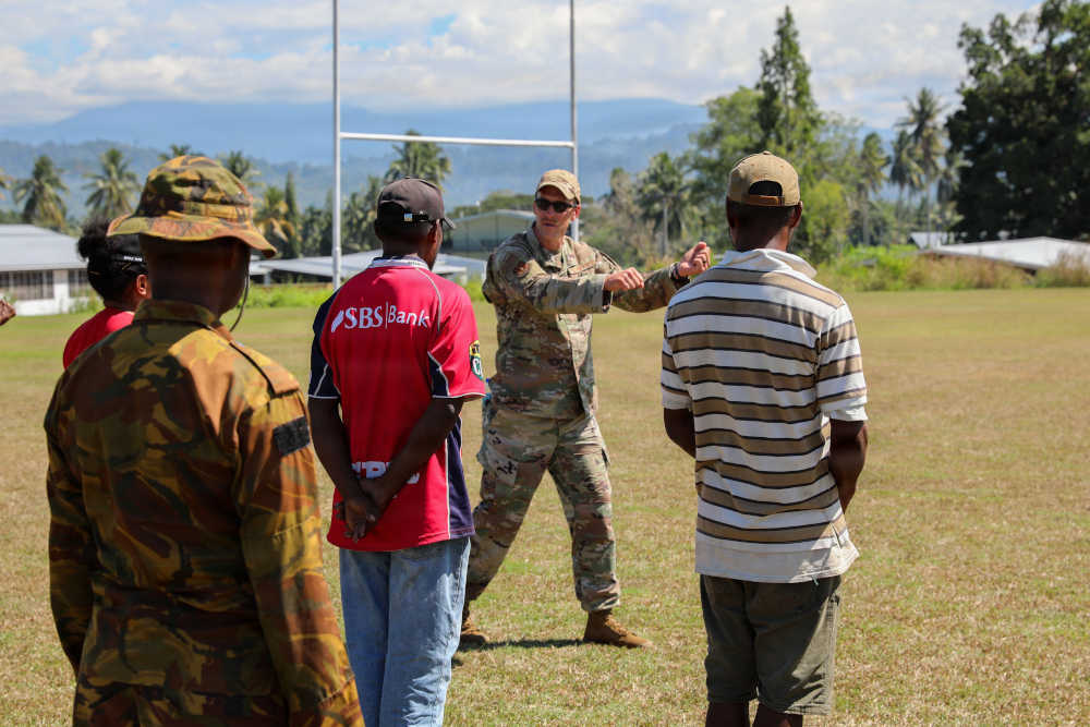 Solider showing how to reach out to someone