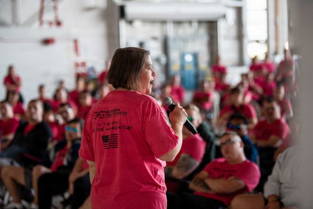 Talking in front of service members before the Refuel Resilience Walk