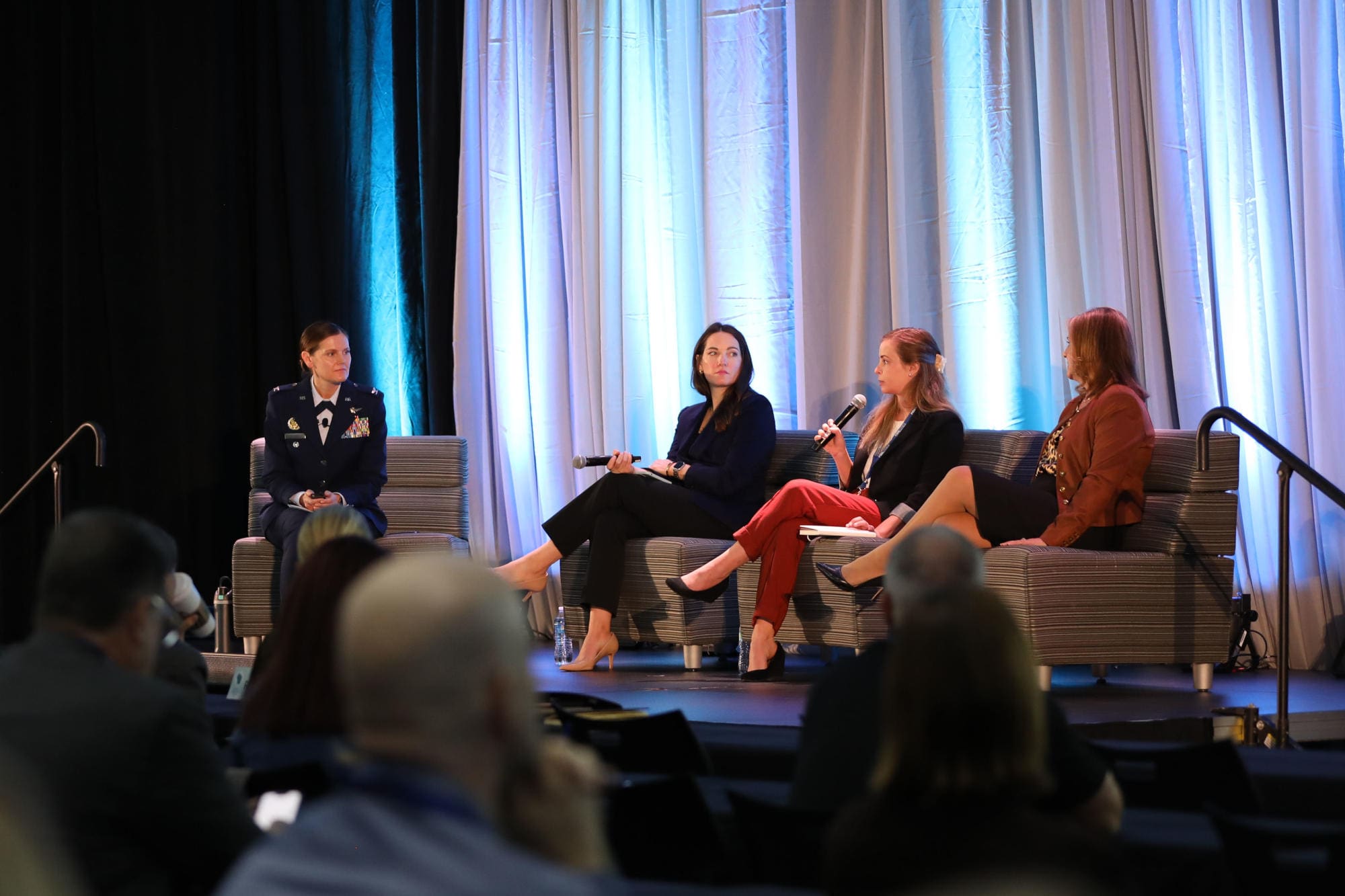 U.S. Air Force Colonel Jeannie Jeanetta, Chief of Staff of the Joint Staff (left), leads a fireside chat at the 2024 Wisconsin Governor’s Cybersecurity Summit with Mary Faulkner, Amy Glasscock, and Genevieve Marquardt at the Fox Cities Exhibition Center in Appleton, Wis., on Oct. 28, 2024. The Wisconsin Governor’s Cybersecurity Summit is an opportunity for professionals to broaden their awareness of cybersecurity threats, and learn how the industry continues to proactively meet challenges and protect the virtual world. (U.S. Army National Guard Photo by Staff Sgt. Payton Wehr)