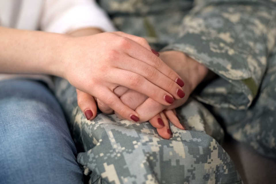 Two people holding hands